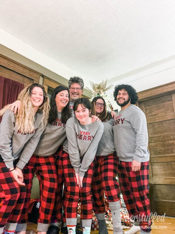 Family wearing matching holiday pjs