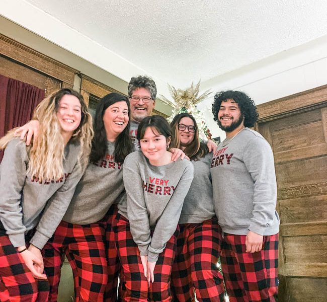 Family wearing matching holiday pjs