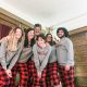 Family wearing matching holiday pjs