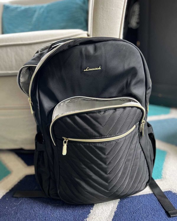 Black backpack with striped lining meant for laptops.